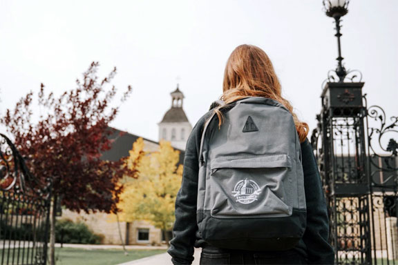 Student with a backpack on campus